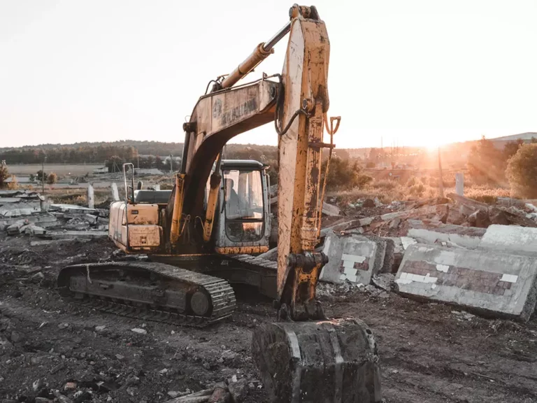 a tractor doing asbestos demolition inspection